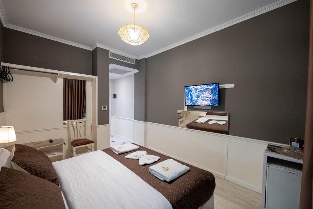 Postel nebo postele na pokoji v ubytování Hotel Aria