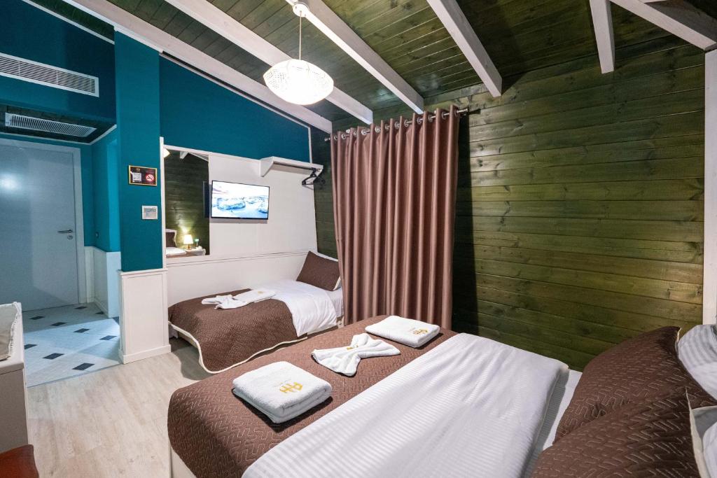 Postel nebo postele na pokoji v ubytování Hotel Aria