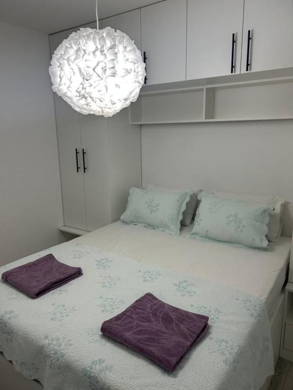 a bedroom with a bed with two towels on it at Sweet Holiday 2 in Mostar