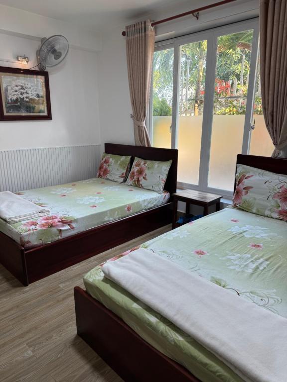 Postel nebo postele na pokoji v ubytování Minh Trang Motel