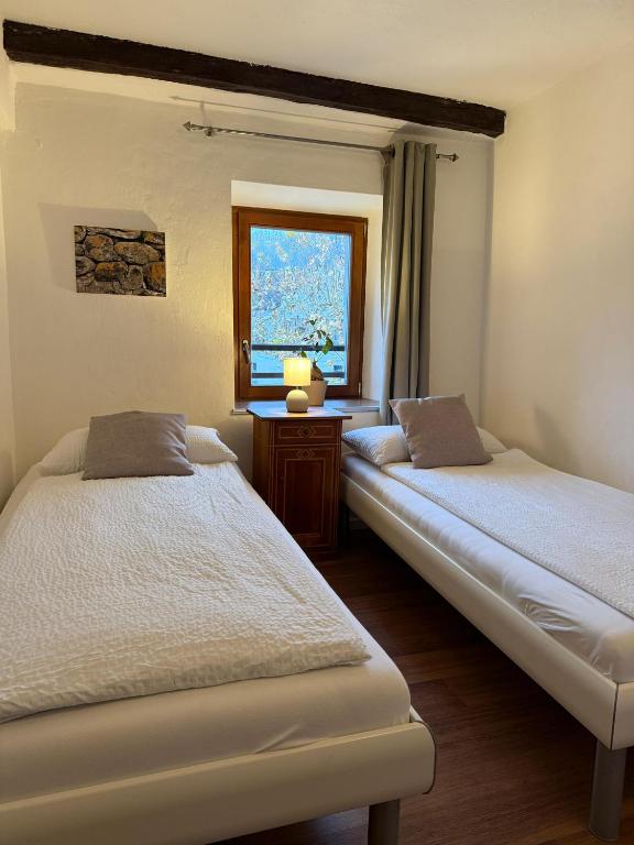 Postel nebo postele na pokoji v ubytování B&B ALLA PIAZZETTA DI TEGNA