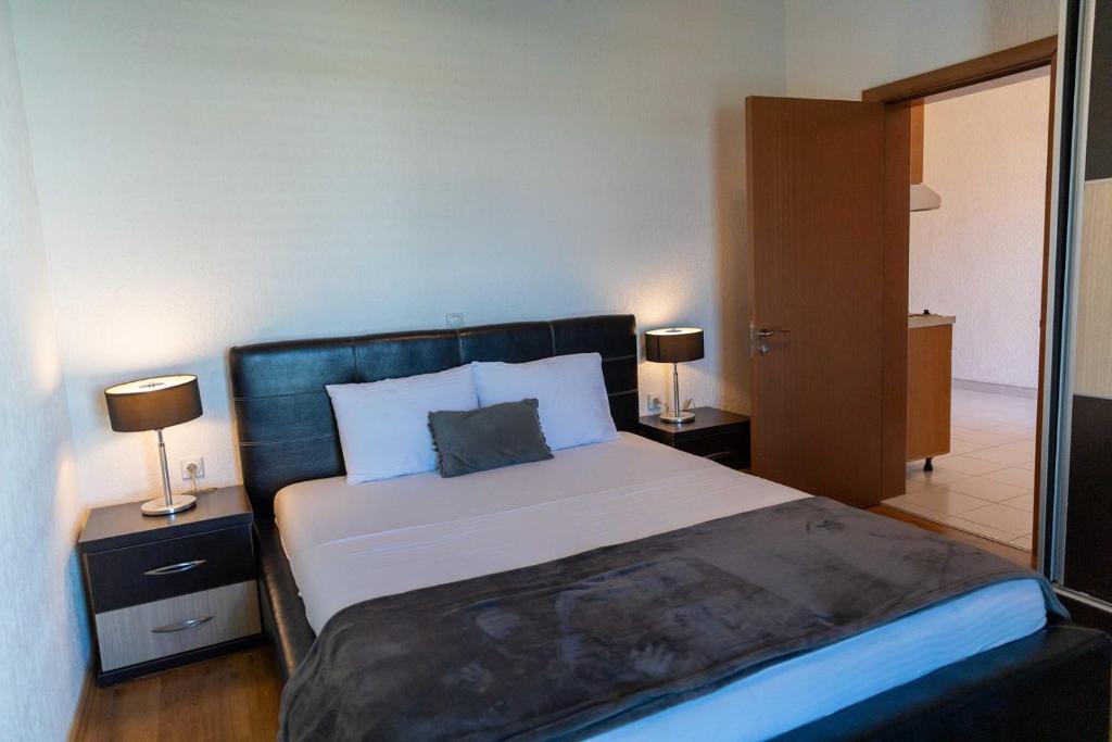 Postel nebo postele na pokoji v ubytování Sunshine Apartments