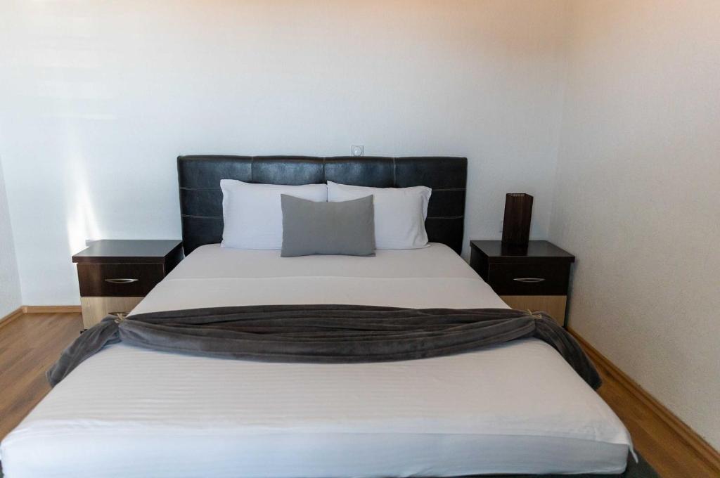 Postel nebo postele na pokoji v ubytování Sunshine Apartments