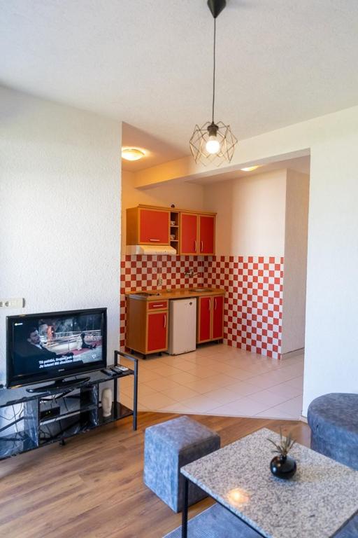 Kuchyň nebo kuchyňský kout v ubytování Sunshine Apartments