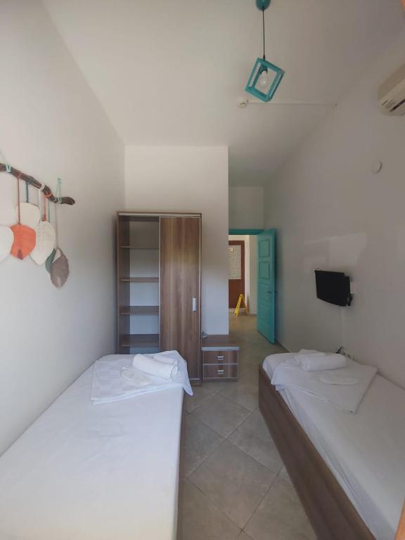 Postel nebo postele na pokoji v ubytování Foça Mint Hotel