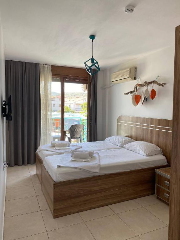 Postel nebo postele na pokoji v ubytování Foça Mint Hotel