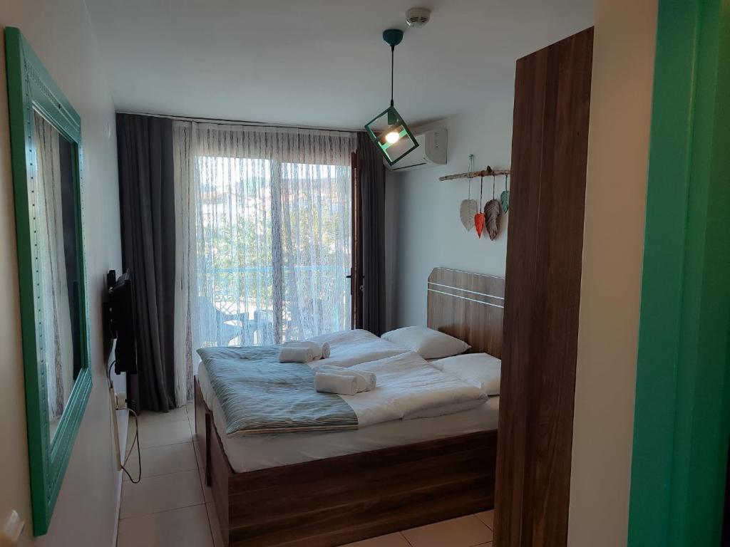 Postel nebo postele na pokoji v ubytování Foça Mint Hotel