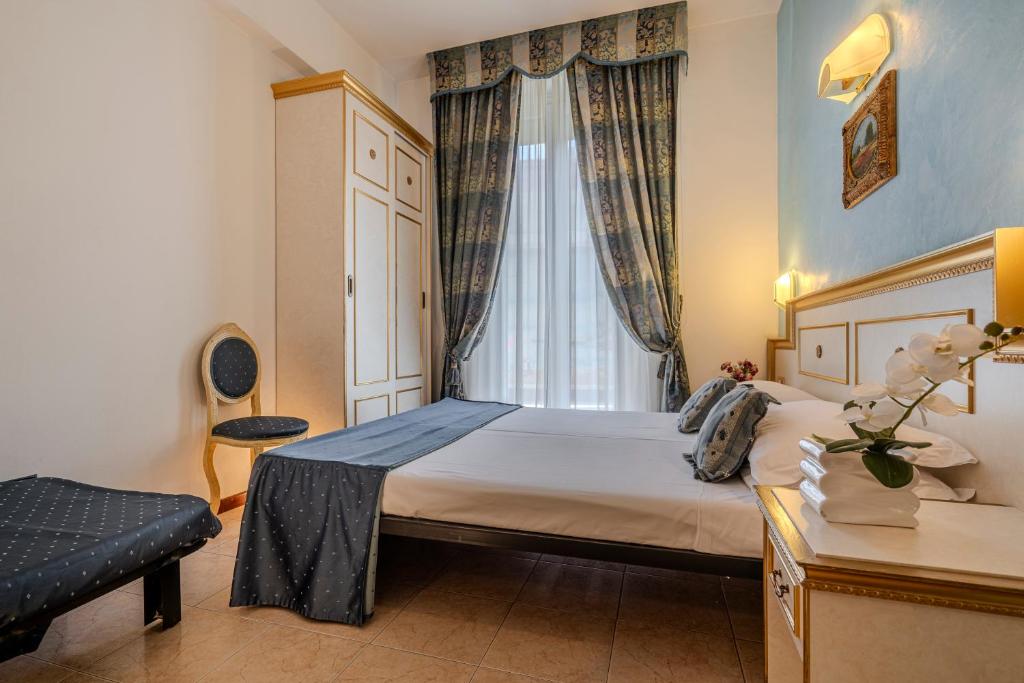 Postel nebo postele na pokoji v ubytování Hotel King