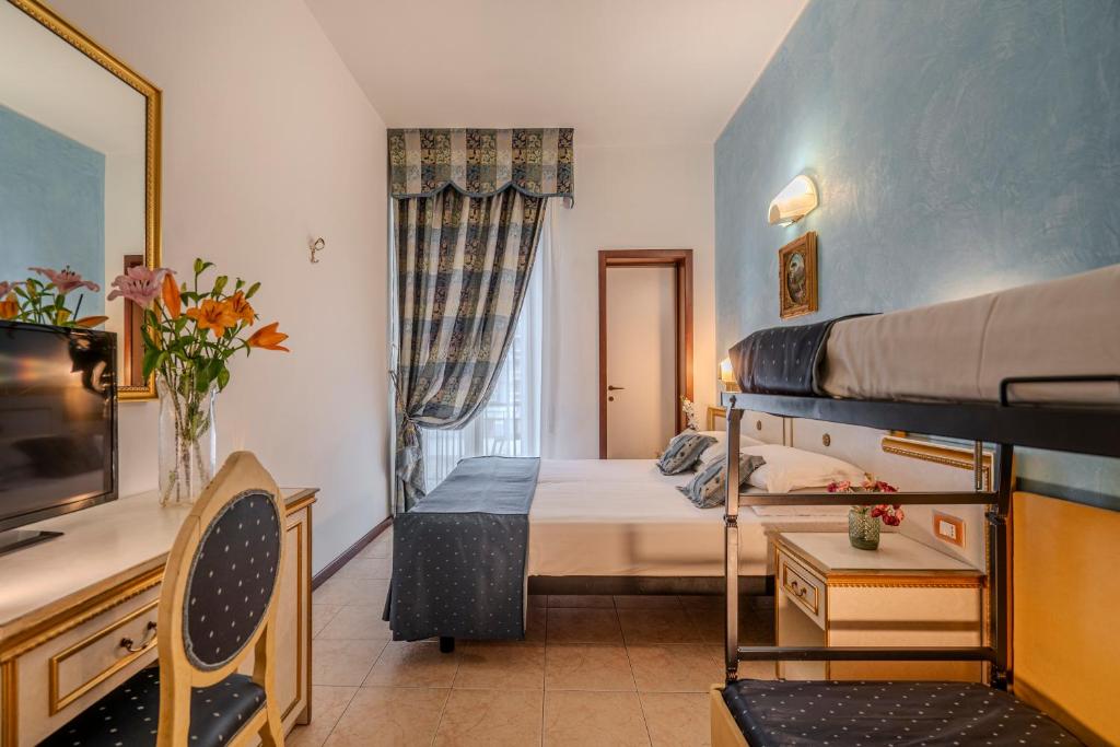 Postel nebo postele na pokoji v ubytování Hotel King