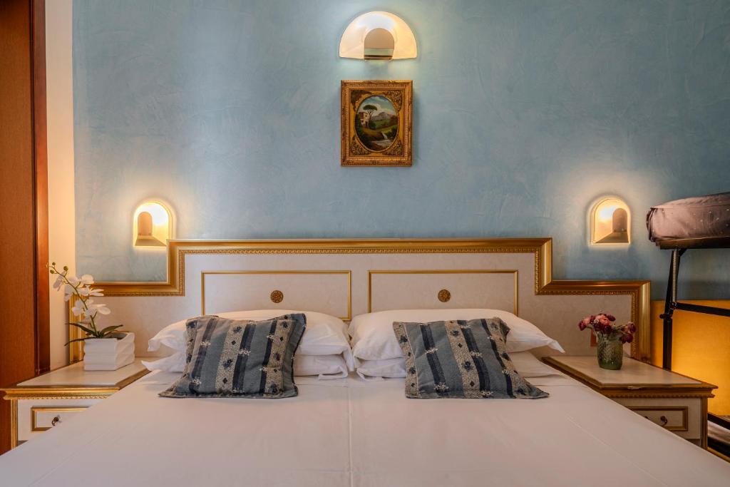 Postel nebo postele na pokoji v ubytování Hotel King