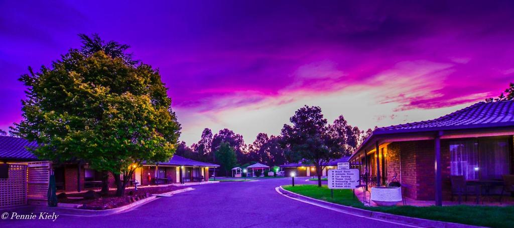 a street in a town with a purple sky at Meninya Palms Resort Moama in Moama