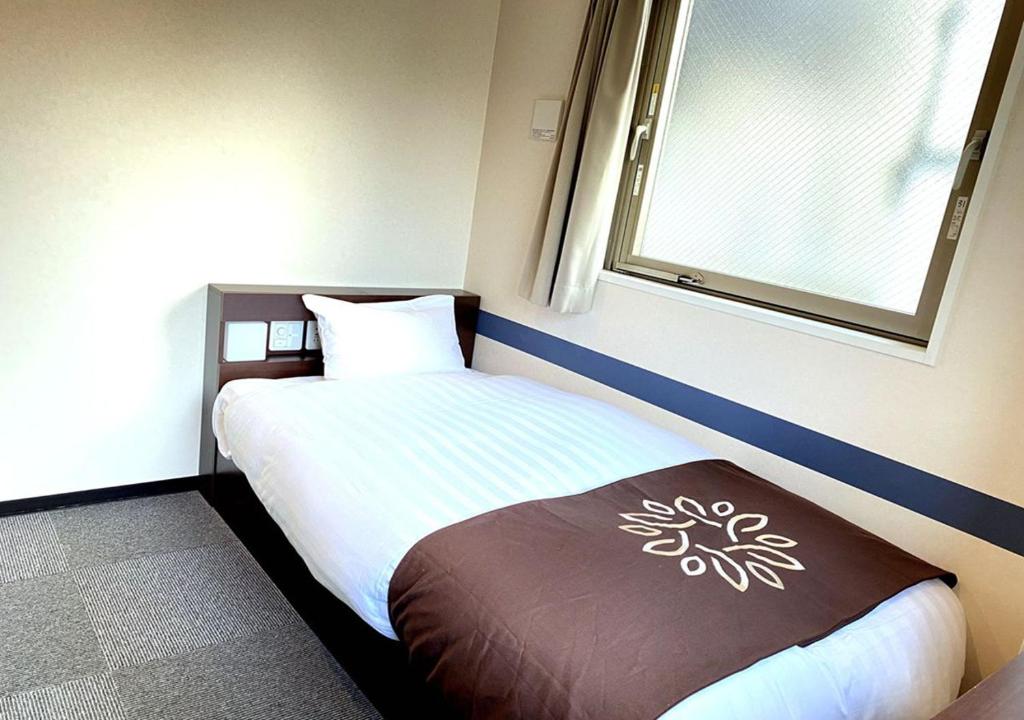 Postel nebo postele na pokoji v ubytování Floral Hotel · SakaisuJi-Honmachi Osaka