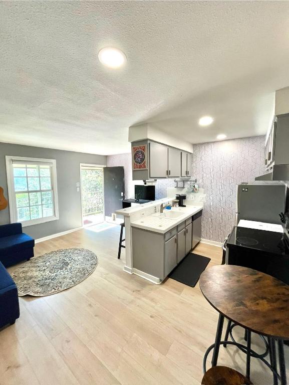 an open kitchen and living room with a table at SoCozy Condo in Austin