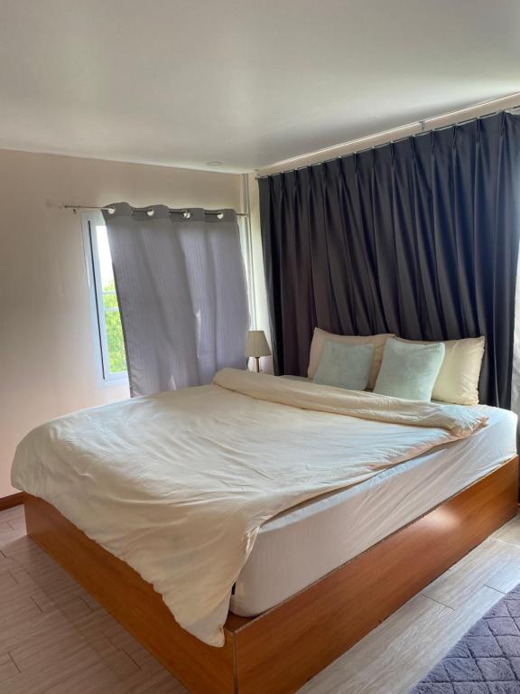 Postel nebo postele na pokoji v ubytování Anna House Doichang