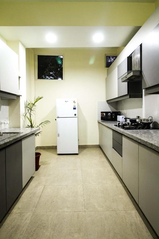 Kuchyň nebo kuchyňský kout v ubytování Anara Service Apartments - Greater Kailash Part II