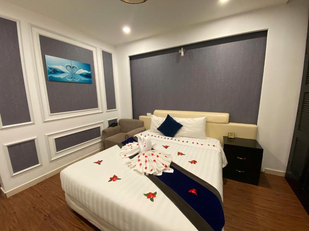 Postel nebo postele na pokoji v ubytování Eclipse Legend Hotel