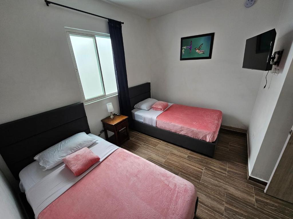 Postel nebo postele na pokoji v ubytování APARTAHOTEL DON BELI