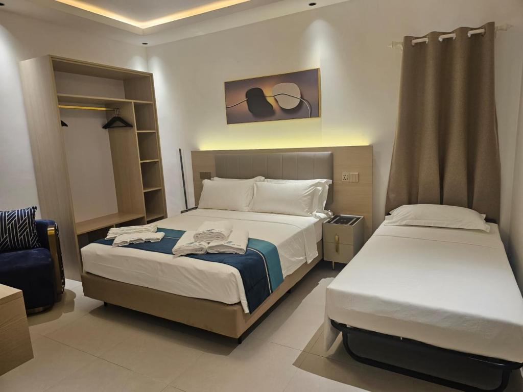 Postel nebo postele na pokoji v ubytování Aqua Heaven Inn