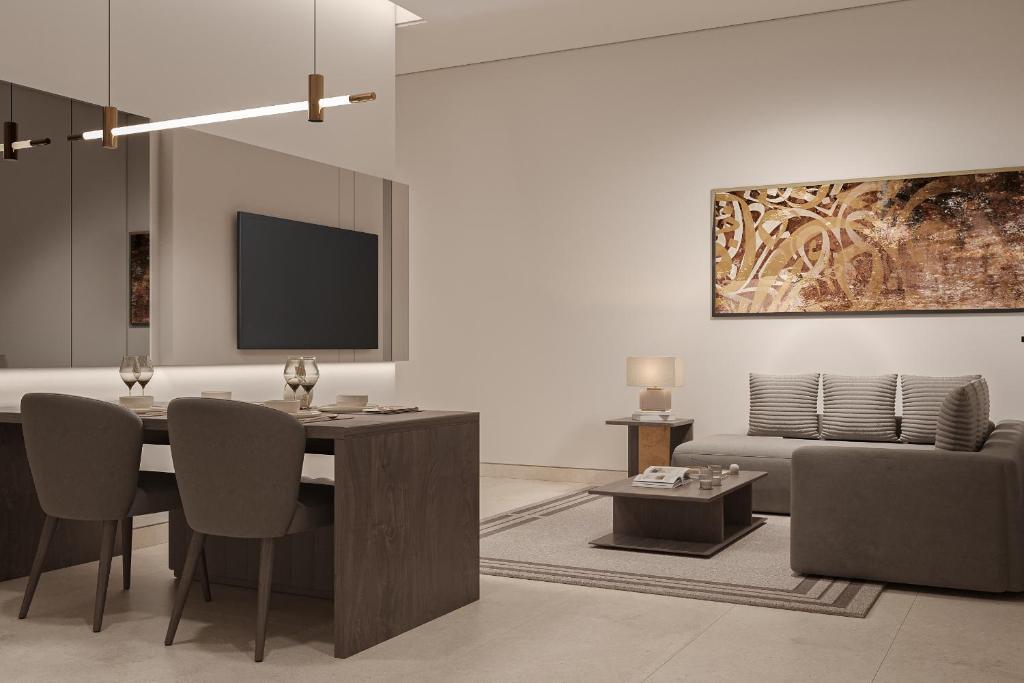 a living room with a table and a couch at فندق ليورا Liora Hotel in Riyadh