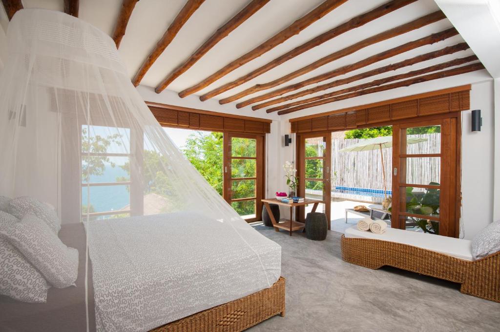 Postel nebo postele na pokoji v ubytování Cape Shark Villas