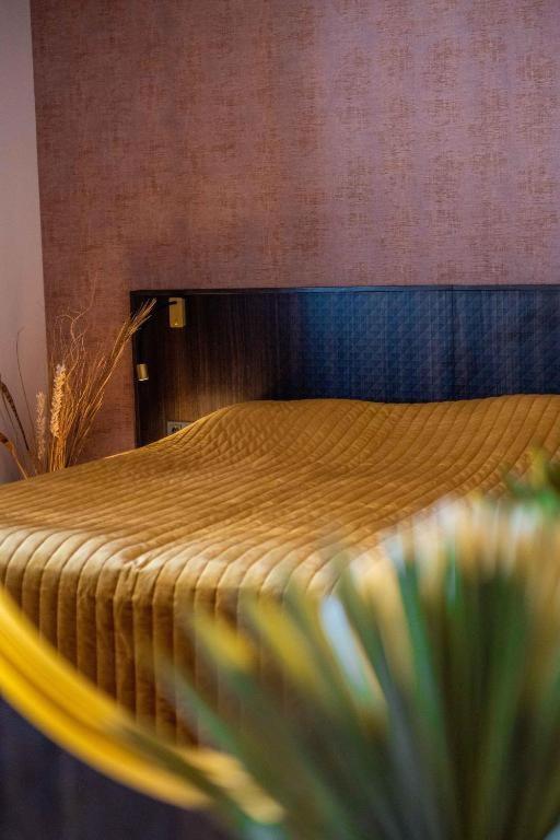 Postel nebo postele na pokoji v ubytování Hotel Veere