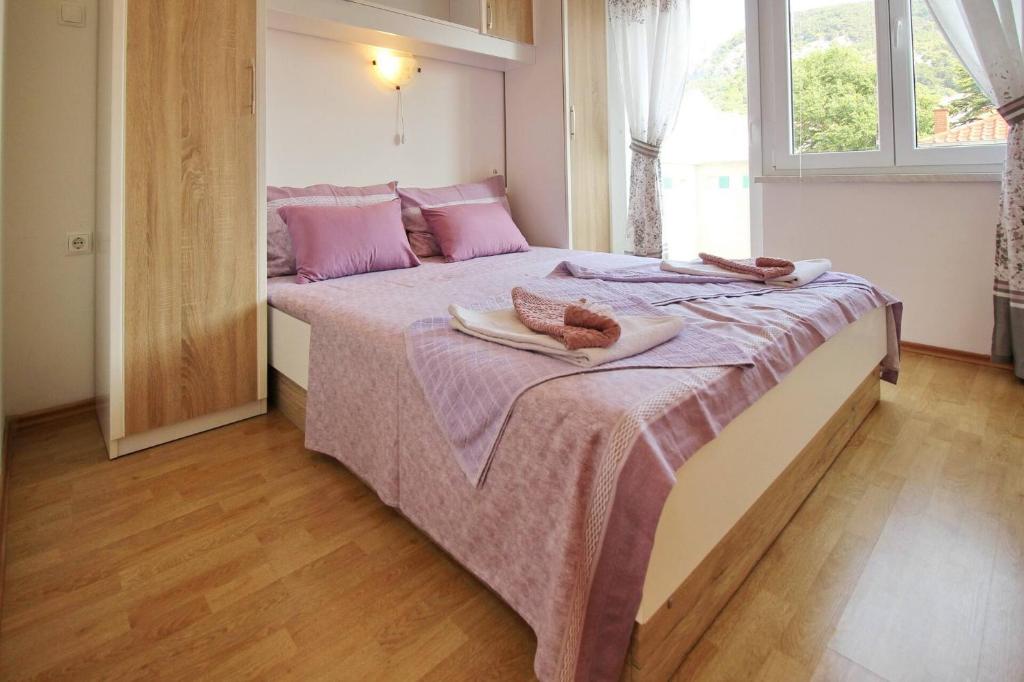 Posteľ alebo postele v izbe v ubytovaní Apartments Aquarium Dorcic
