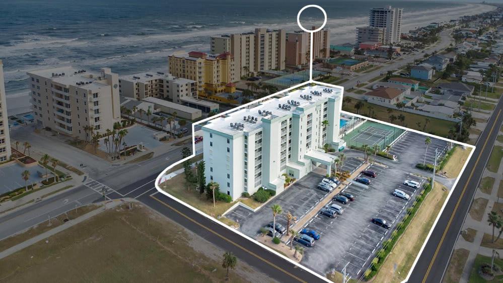 an aerial view of a city with a building at Relaxing Ocean Condo Steps from the Beach in Daytona Beach Shores