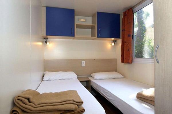 Postel nebo postele na pokoji v ubytování Eurocamp Mobile Homes Terme Catez