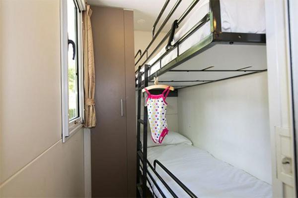 Postel nebo postele na pokoji v ubytování Eurocamp Mobile Homes Terme Catez