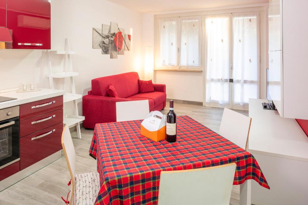 a kitchen with a table with a bottle of wine on it at Apartment Alba Gardena in Bardolino