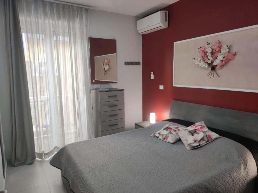 Postel nebo postele na pokoji v ubytování Casa Orchidea Mazzeo