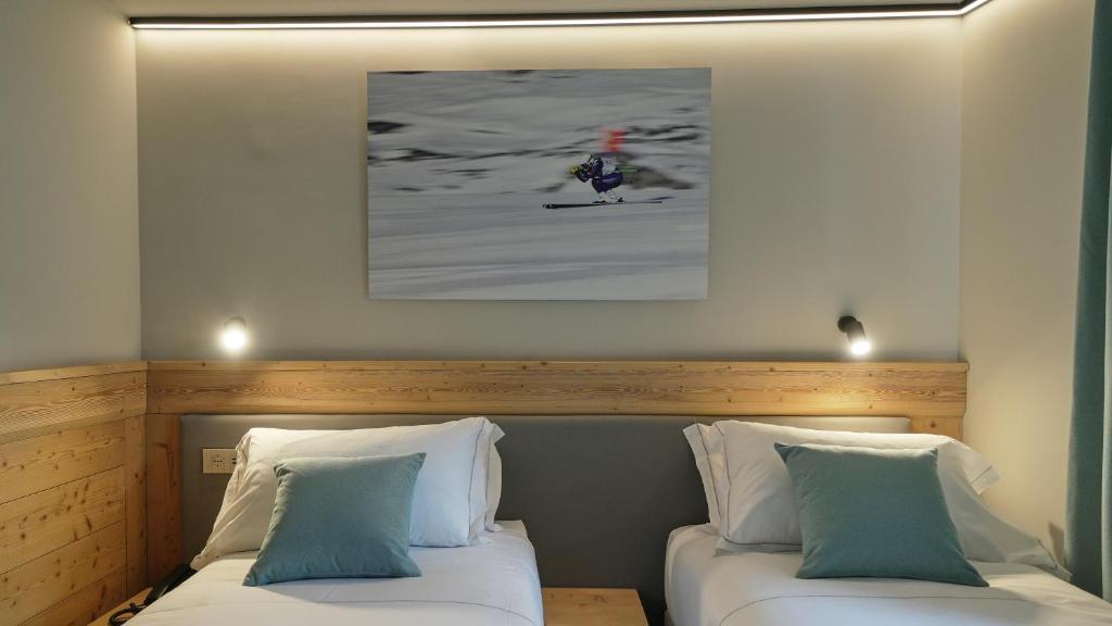 Postel nebo postele na pokoji v ubytování Hotel Perruquet