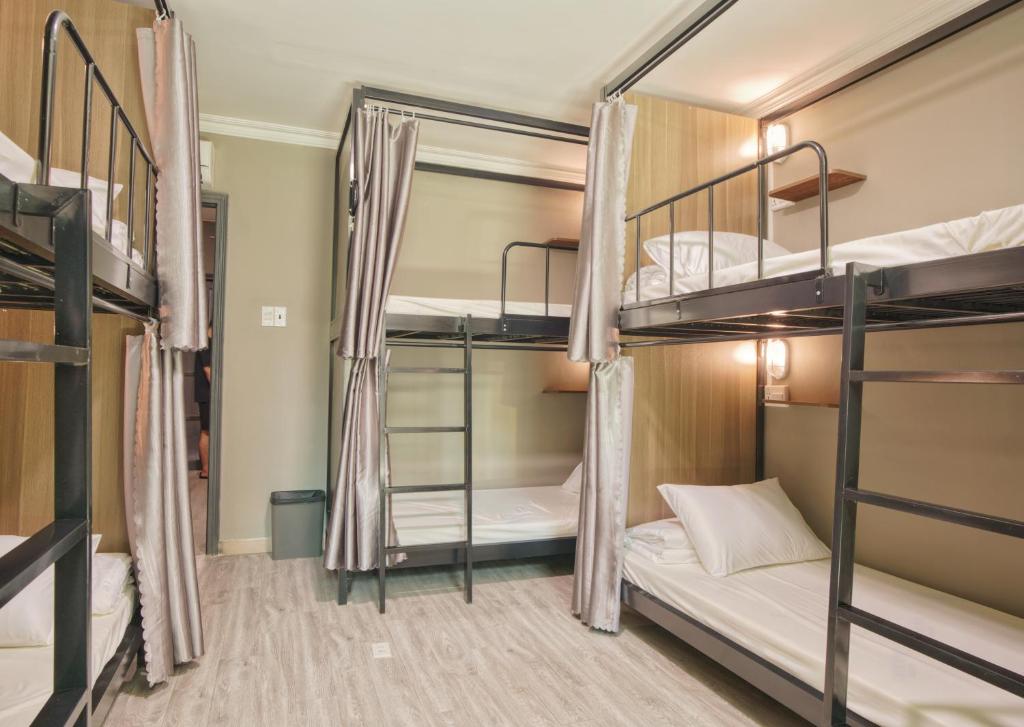 Postel nebo postele na pokoji v ubytování Triple Hostel