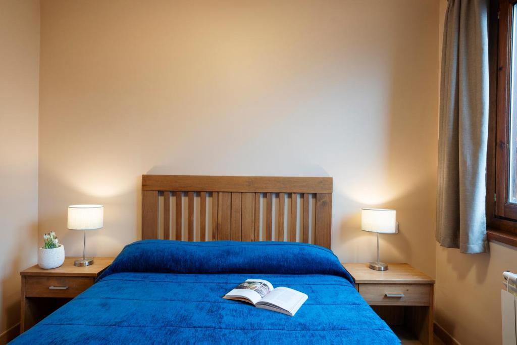 Postel nebo postele na pokoji v ubytování Aparthotel Ona el Tarter