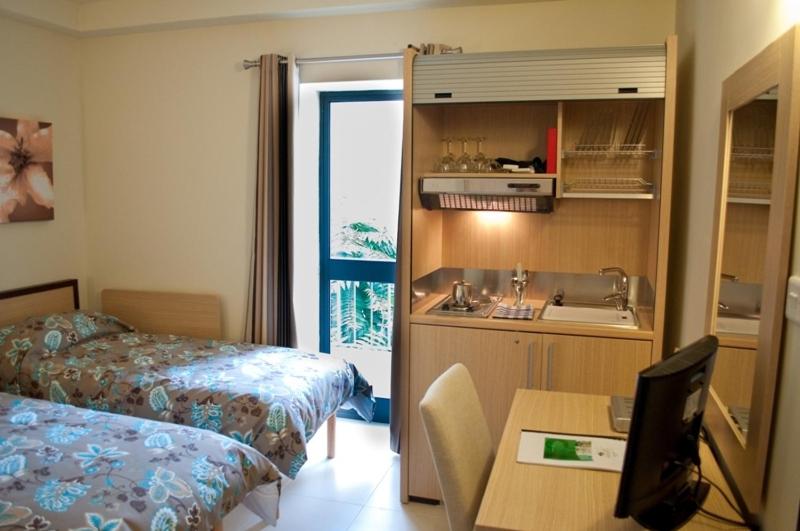 Postel nebo postele na pokoji v ubytování Hotel Kappara