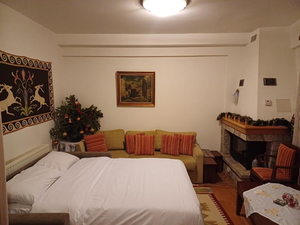 Postel nebo postele na pokoji v ubytování Ξύλο & Παράδοση