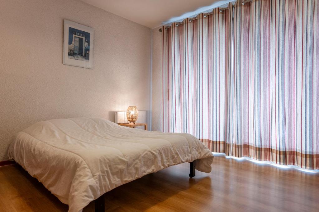 Postel nebo postele na pokoji v ubytování Escapade Perchée - Vue - Balcon - Parking