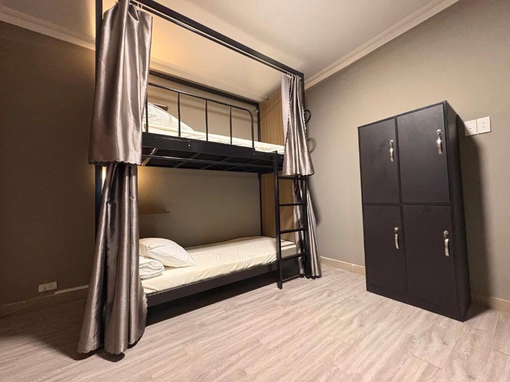 Postel nebo postele na pokoji v ubytování Triple Hostel