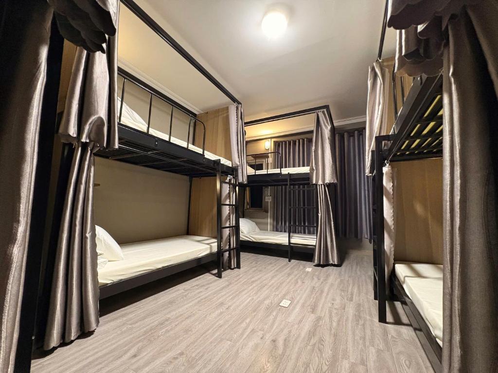 Postel nebo postele na pokoji v ubytování Triple Hostel
