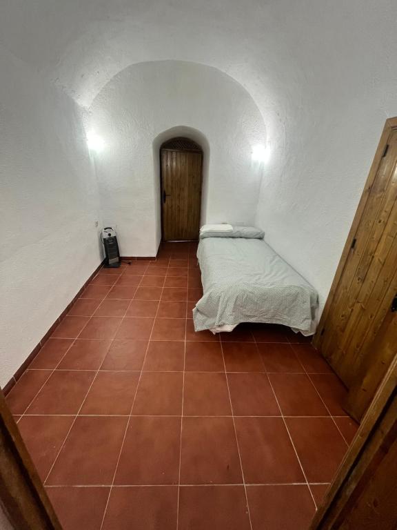 Postel nebo postele na pokoji v ubytování Casa Cueva la estación