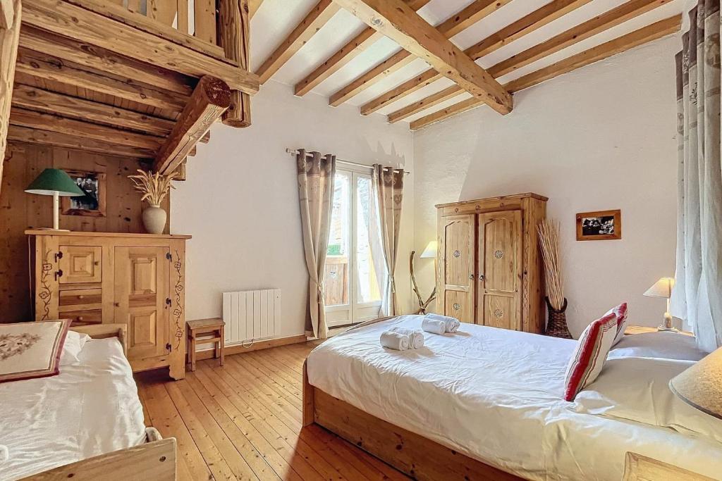 Ένα ή περισσότερα κρεβάτια σε δωμάτιο στο Chalet La Marmottière