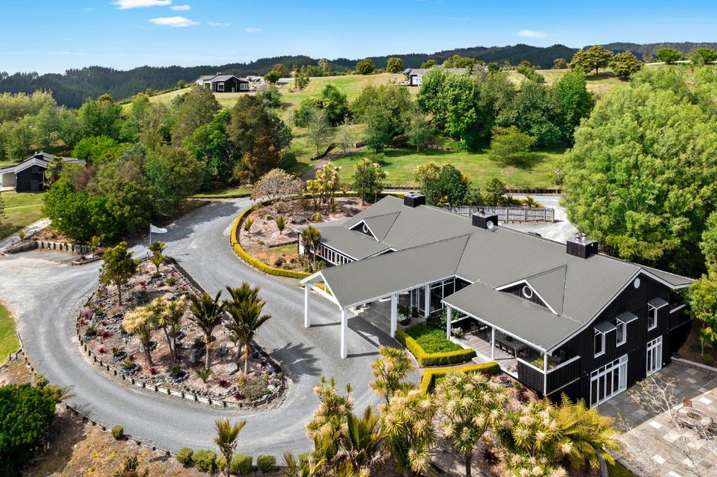 an aerial view of a house with a garden at Woodhouse Mountain Lodge in Warkworth