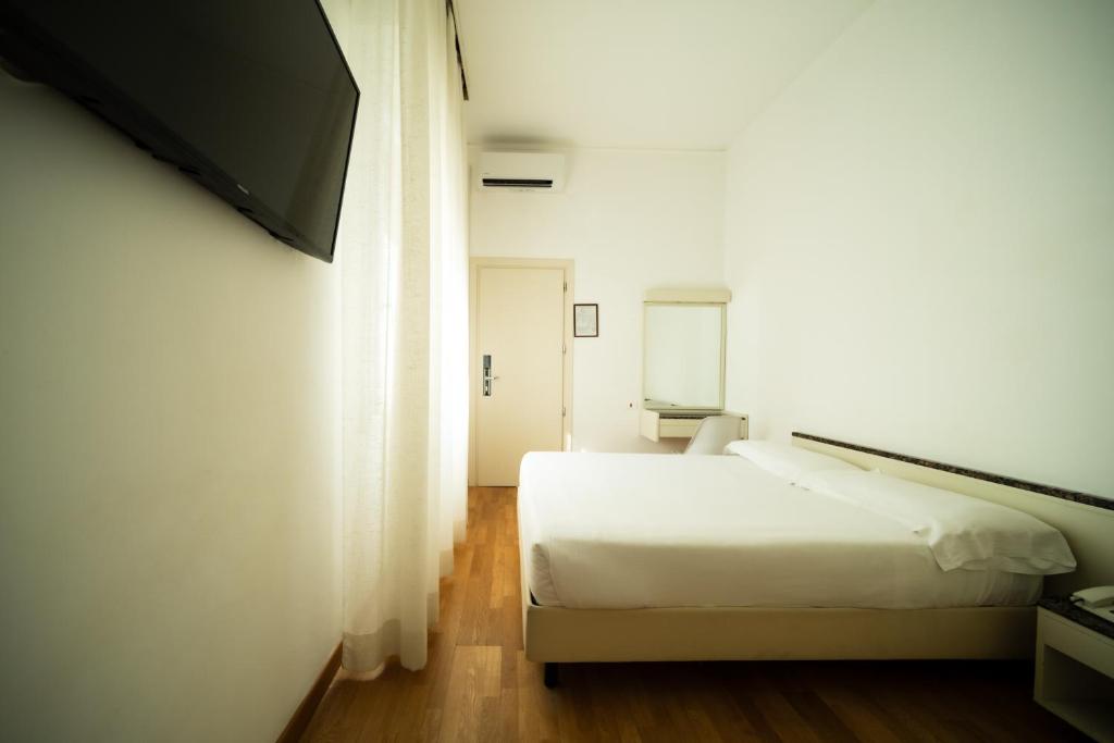 Postel nebo postele na pokoji v ubytování Hotel Rosabianca