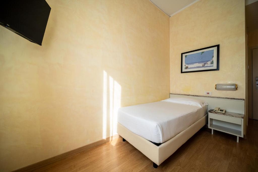 Postel nebo postele na pokoji v ubytování Hotel Rosabianca