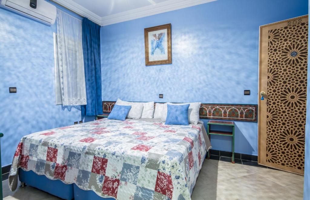 Postel nebo postele na pokoji v ubytování Hotel Tarek
