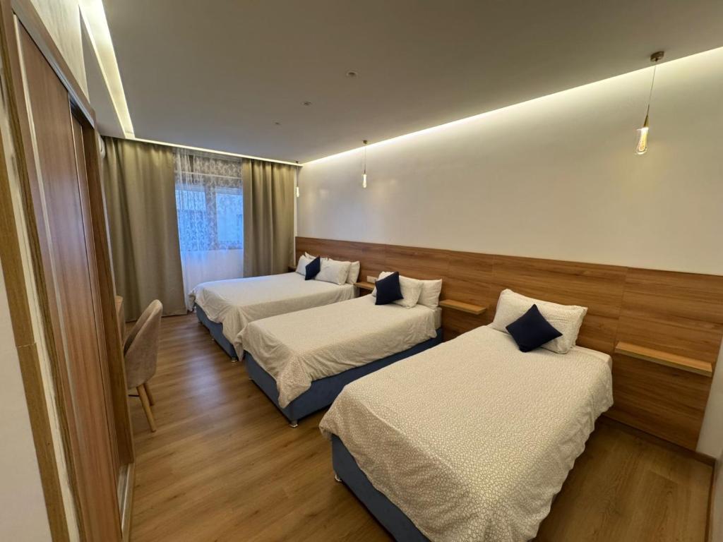 Postel nebo postele na pokoji v ubytování Hotel Tarek