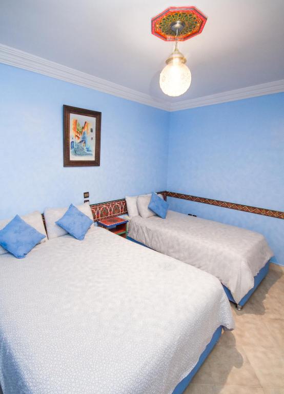 Postel nebo postele na pokoji v ubytování Hotel Tarek