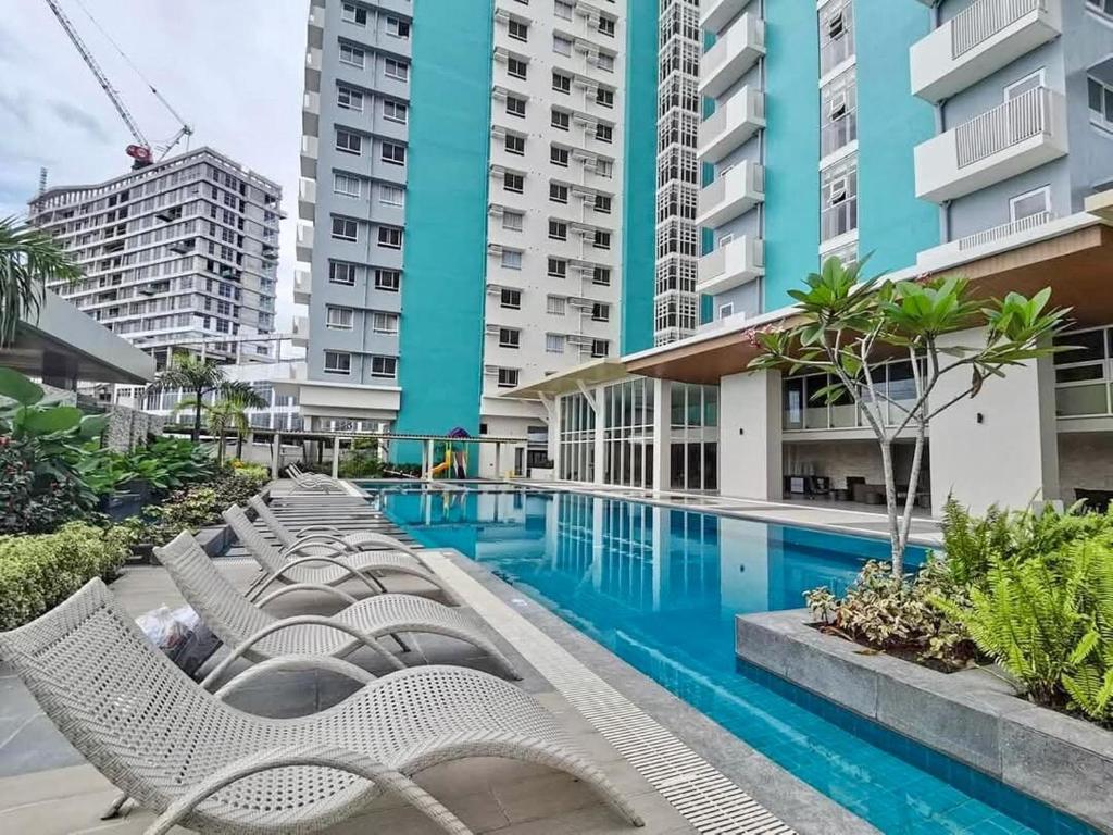 a pool in the middle of a building at K Residence at 1910 - Fully styled studio with sea view in Bacolod