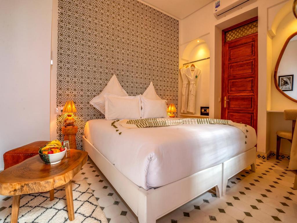 Postel nebo postele na pokoji v ubytování Dar Al-Famila Hamam & Spa