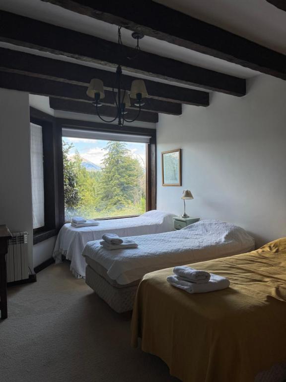 Postel nebo postele na pokoji v ubytování Hosteria Naranjo en Flor